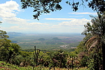 "View from a community in Telica, Nicaragua. Corn in the foreground, with mountains, volcanoes, and a geothermal energy plant."